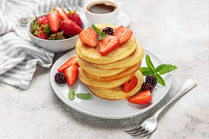 Stack of pancakes with fresh strawberries and blackberries for b, a Food & Drink Photo by Olena Rudo