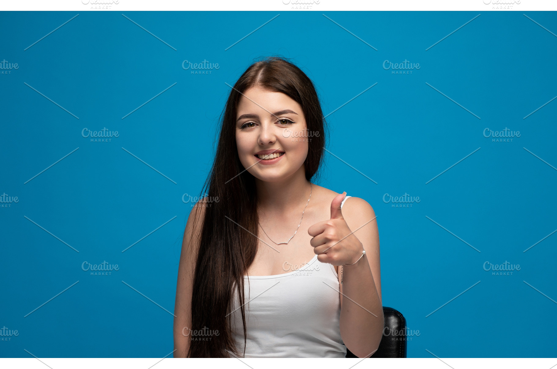 Young woman smiling and giving, a Person Photo by volodymyrshtun13795
