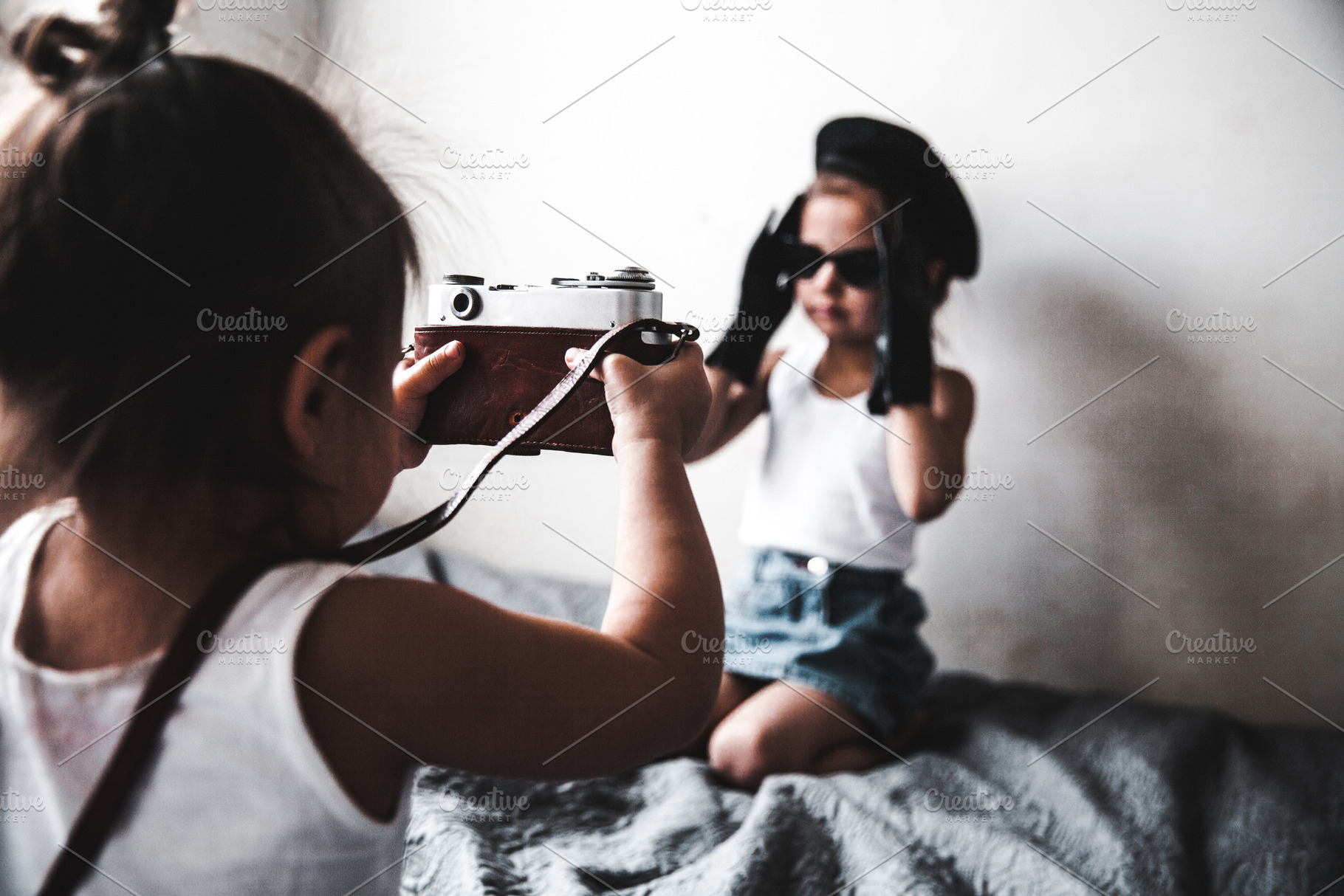 Two little girls taking a picture, a Beauty & Fashion Photo by OS