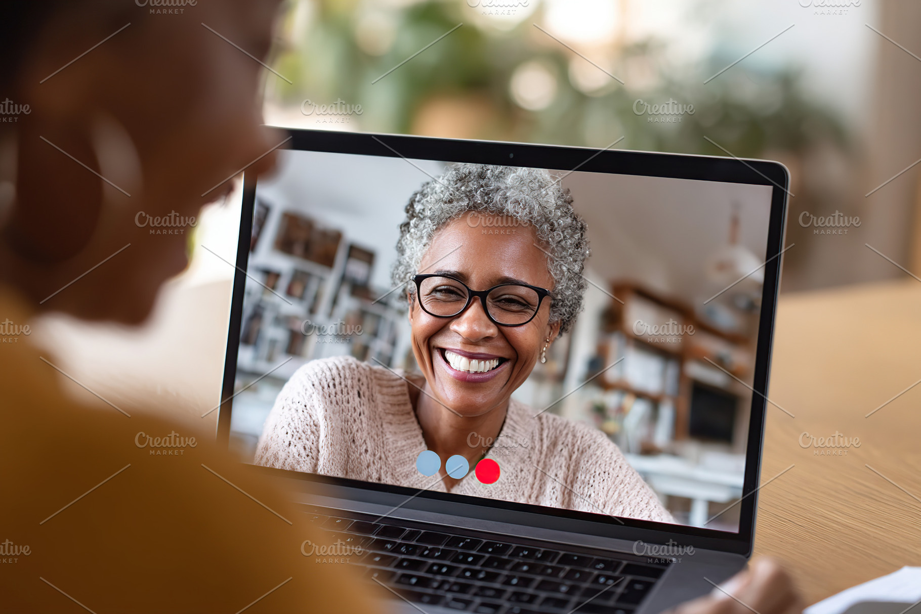 Therapy session taking place on a laptop with a smiling therapist and client in, a Photo by AlyaAnd
