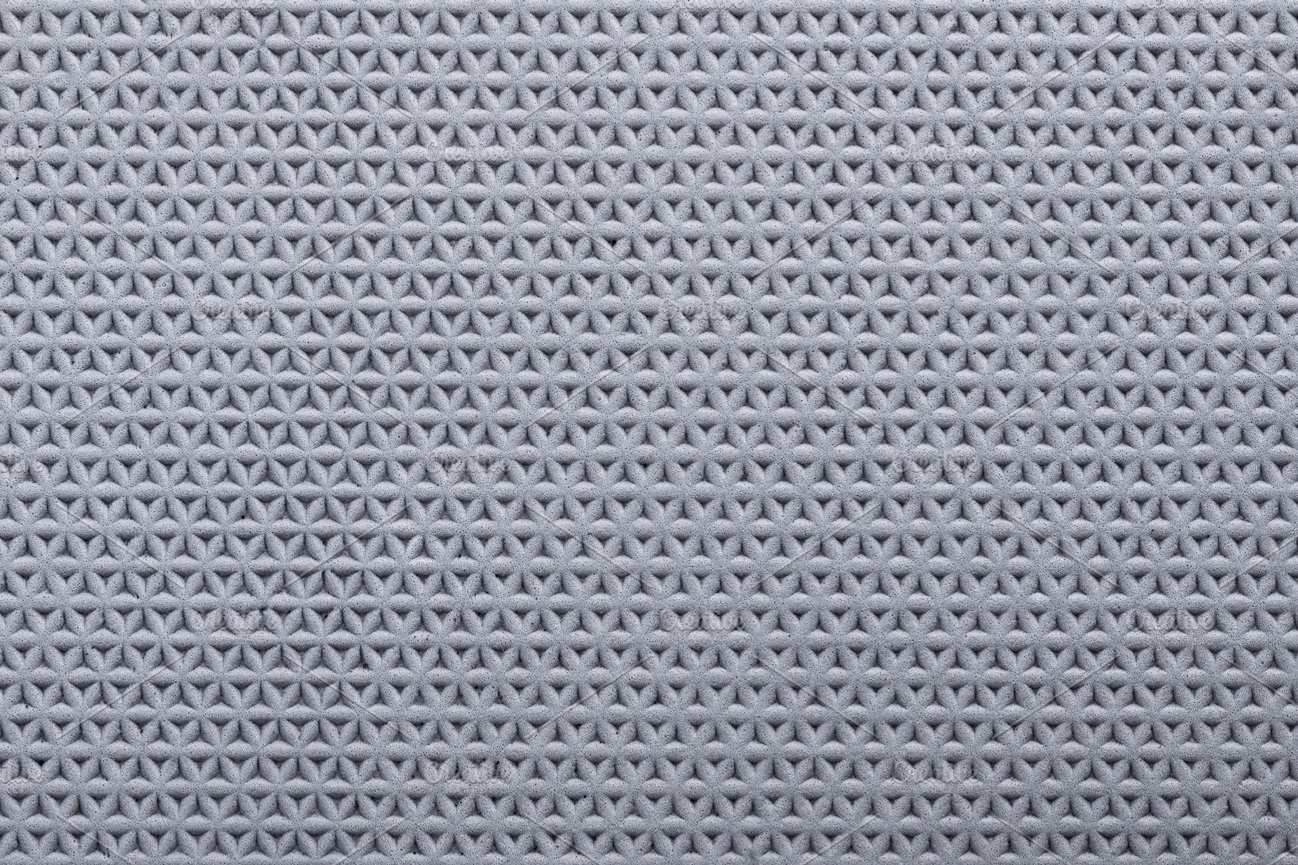 Close-up of a gray textured surface with a repeating geometric p, a Background Photo by Ales Munt
