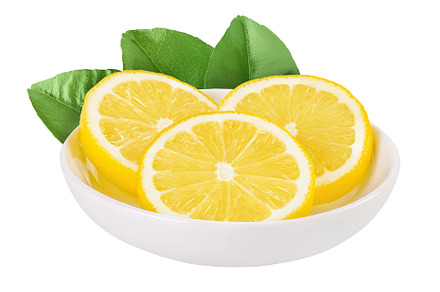 Ripe lemon slices in ceramic bowl, a Food & Drink Photo by NataPhoto
