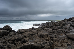 Calm seascape with rocks at Playa Loberia, San Cristobal, a Nature Photo by GoodGoods