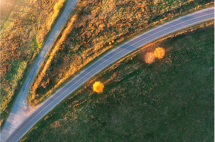 Aerial view of winding road in, a Transportation Photo by den-belitsky