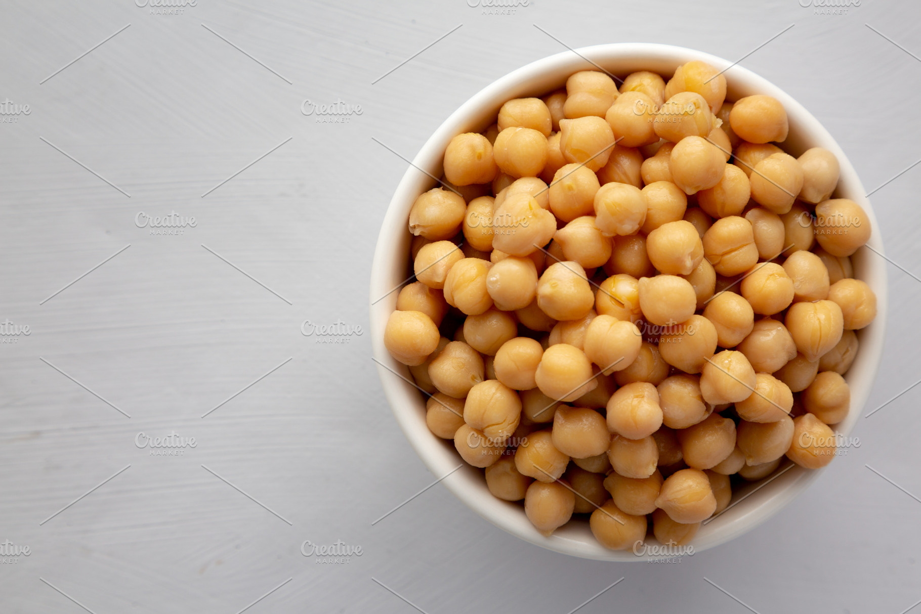 Homemade Preserved Chickpeas in a Bowl, top view. Copy space., a Food & Drink Photo by LiudmylaChuhunova