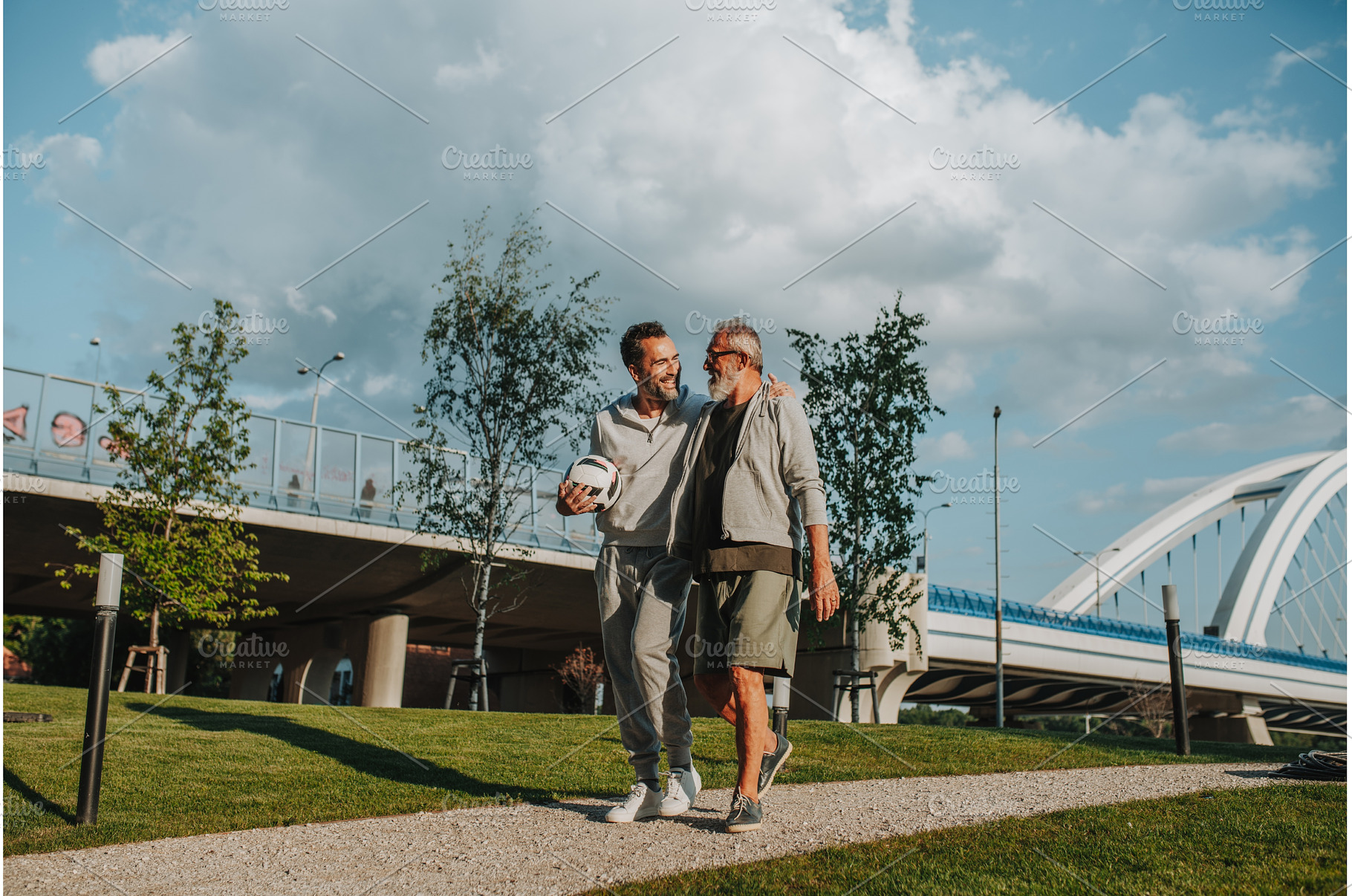 Sporty father and adult son walking, a Person Photo by HalfPoint