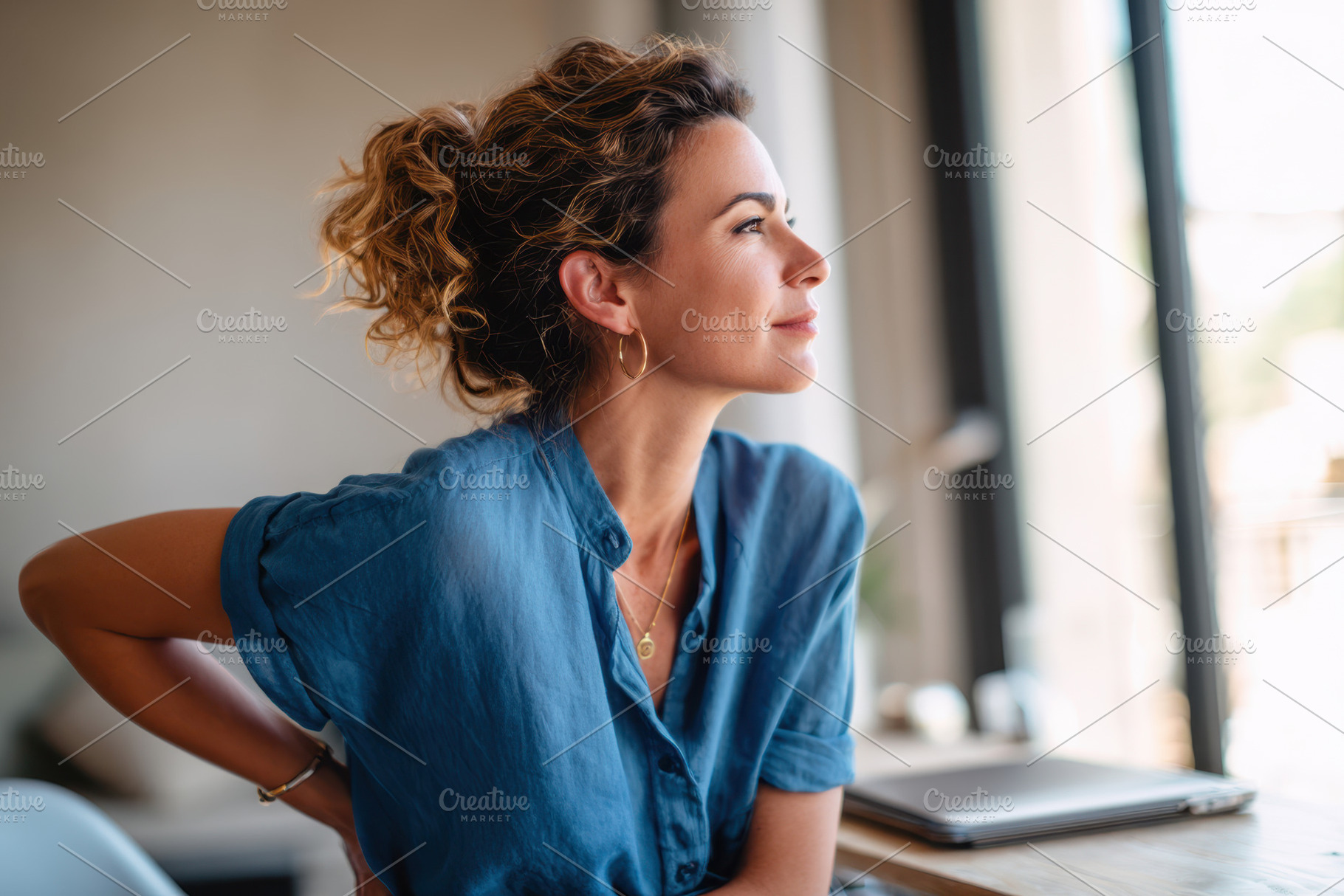 Woman experiencing back pain at modern office desk, a Person Photo by AlyaAnd