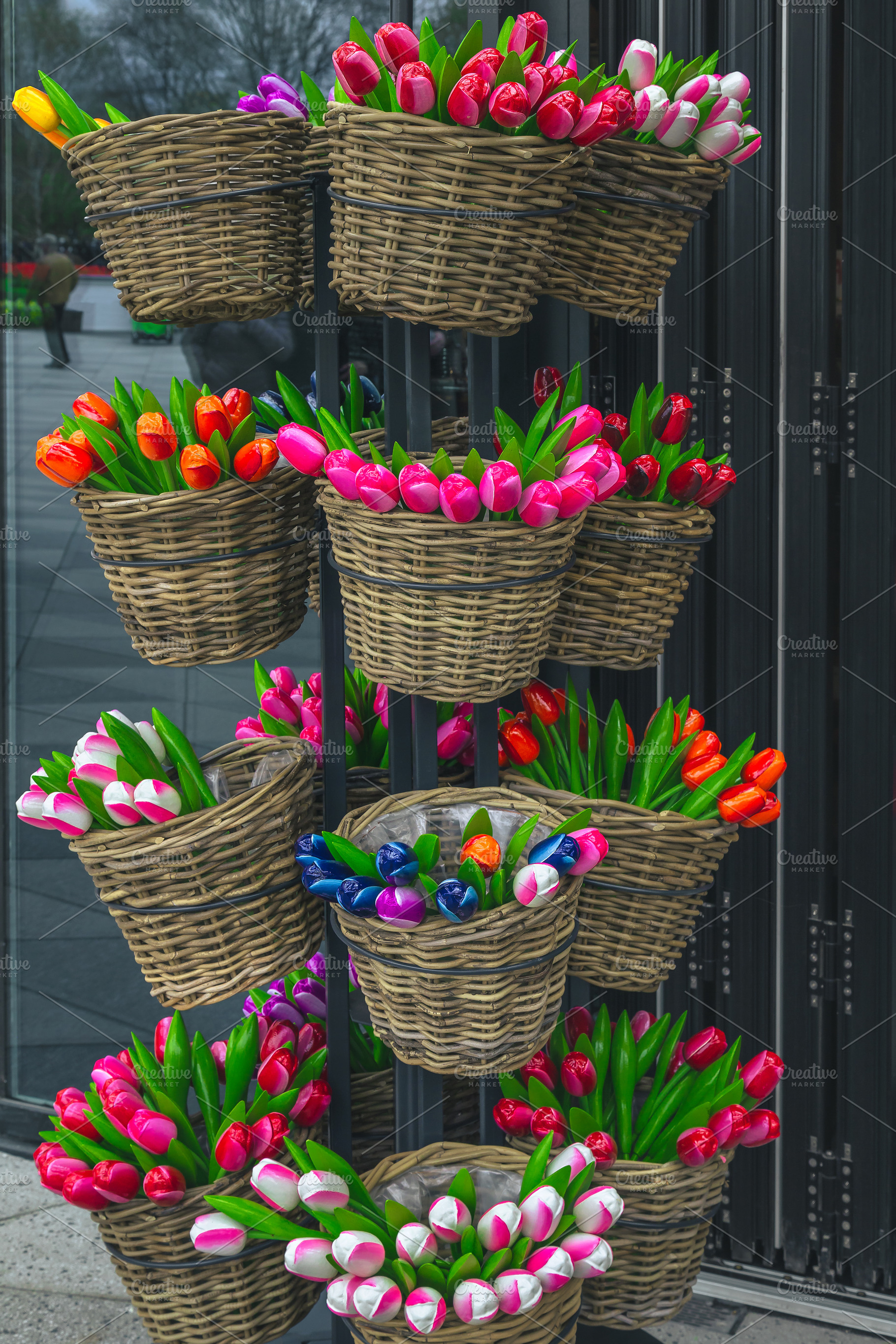 Colorful wooden tulips in the basket, a Business Photo by Alpine Dreams
