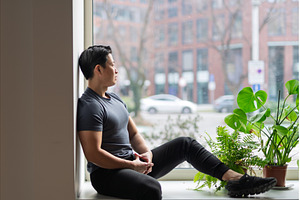 Confident young man sitting by the, a Person Photo by HalfPoint