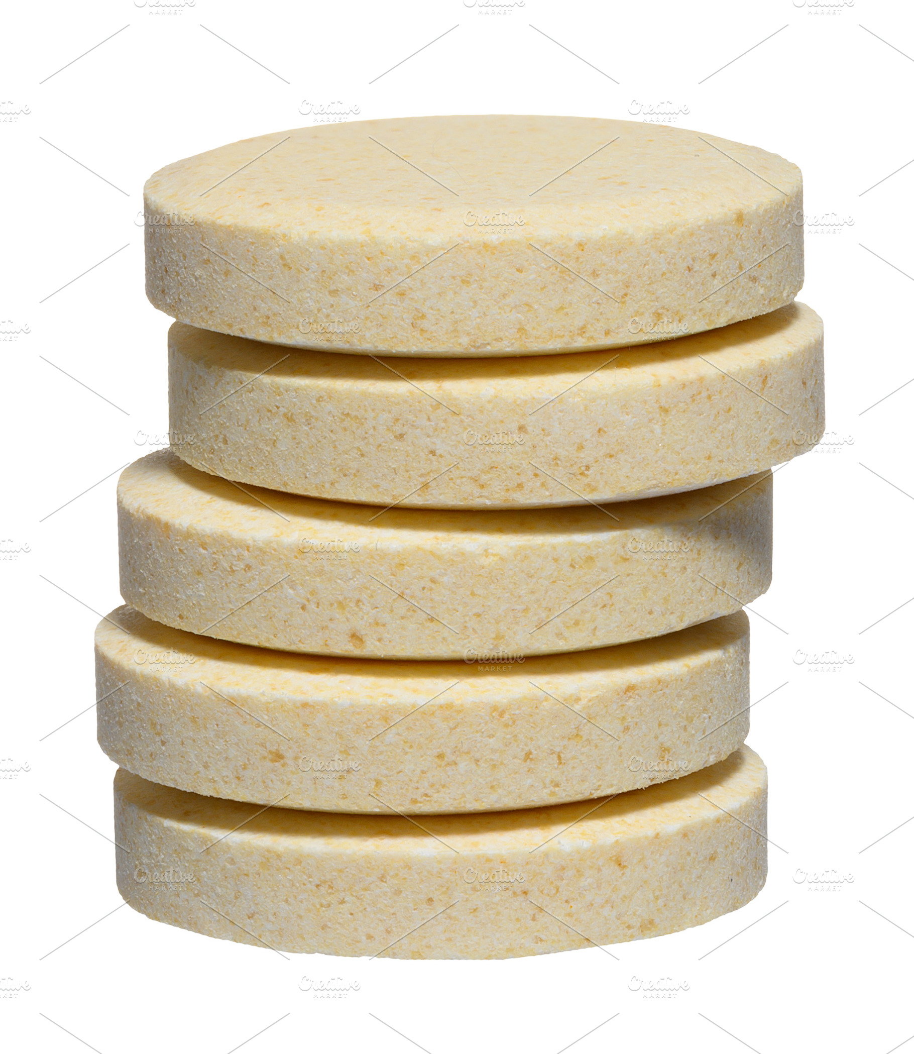 Vertical stack of large round pills of light yellow color, isola, a Food & Drink Photo by ndanko