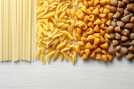 Various kind of uncooked pasta. Generative AI, a Food & Drink Photo by AlyaAnd