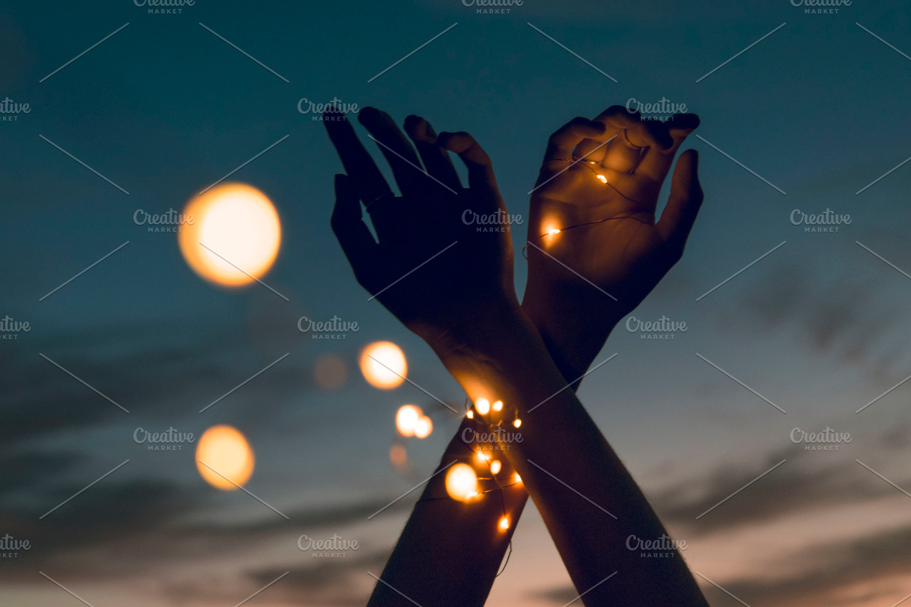 Crossed Hands with Lights, a Person Photo by Fossilized Tree Sap