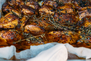 Meal cooking roasting meat hand baking tray herbs, a Food & Drink Photo by Photo Drive Studio