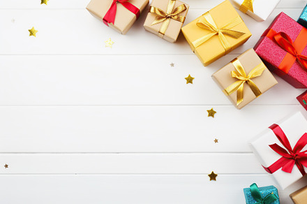 Christmas gift boxes on white wooden background, a Holiday Photo by AlyaAnd
