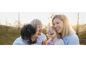 Spring portrait of parents with two, a Person Photo by HalfPoint