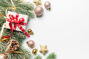 Christmas gift box with fir branches and ornaments, a Holiday Photo by Olena Rudo