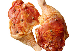 Raw chicken legs and thighs marinated with spices and peppercorn, a Food & Drink Photo by ndanko