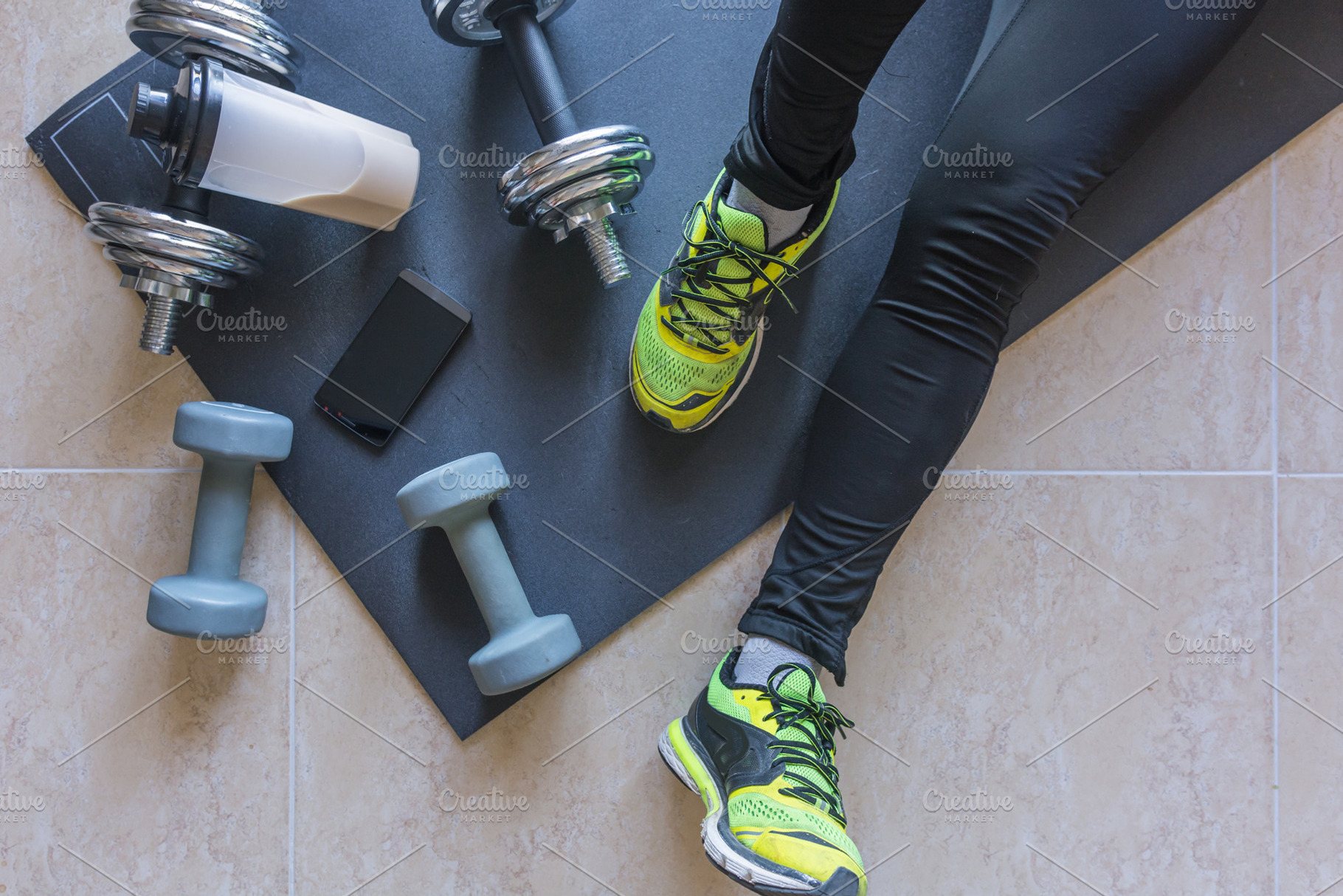 Dumbbell and mat training at home stock photo containing active and activity, a Sports & Recreation Photo by expressiovisual