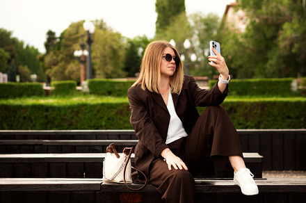 Young woman sitting outdoors