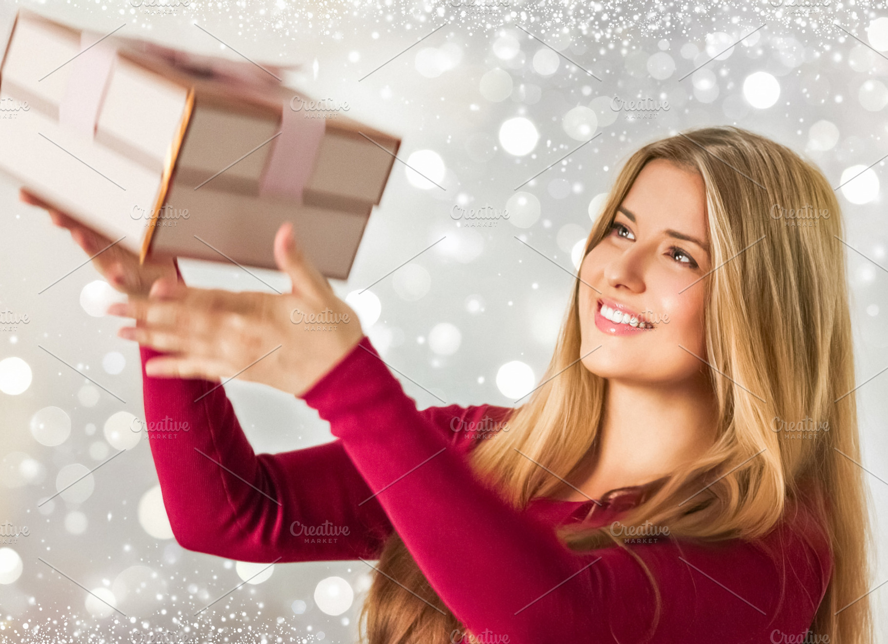 Happy young woman catching a holiday gift box, smiling, celebrat, a Person Photo by Studio ANNA