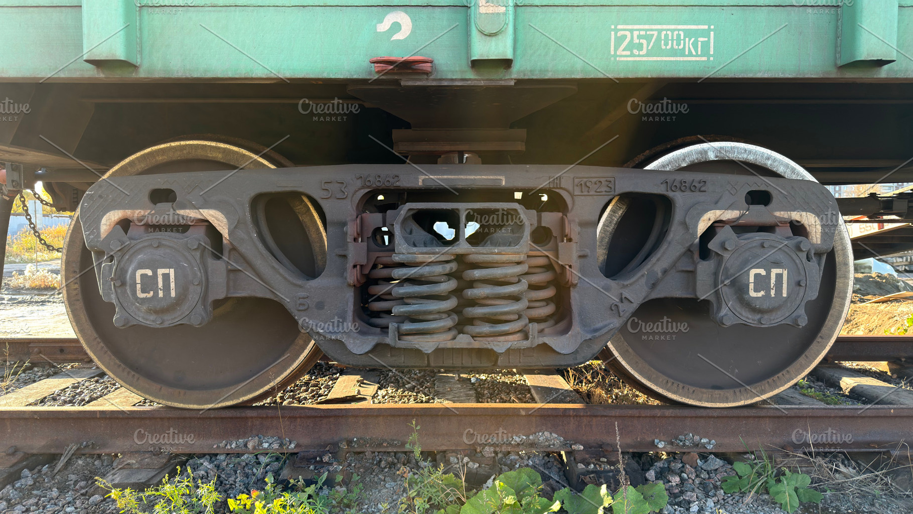 A close-up view of a train wheel assembly, showcasing the wheel, axle, and susp, an Industrial Photo by Textures & Backgrounds