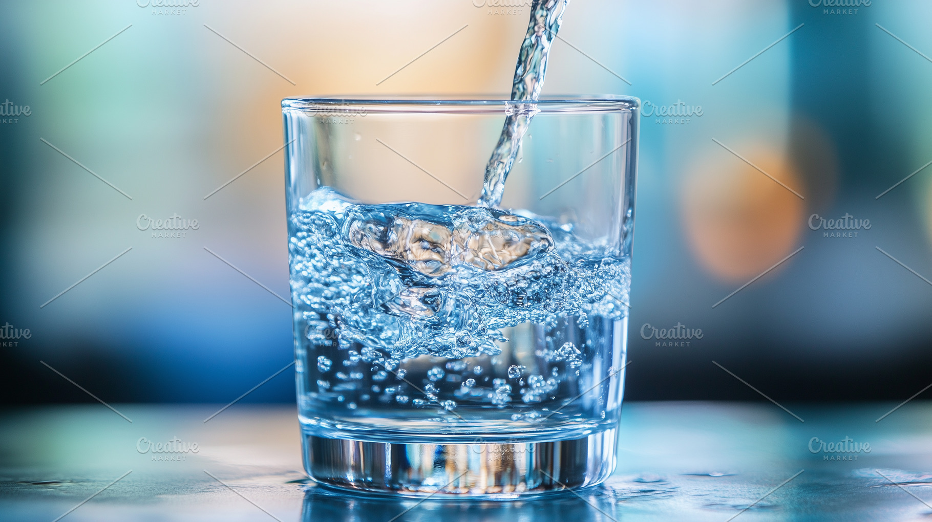 Fresh water being poured into clear, a Photo by MistyDay