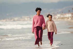 Mom and daughter on beach, a Photo by Beautiful things