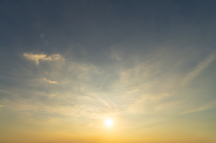 Sunset sky. Abstract nature background. Dramatic blue with orang, a Background Photo by Tampatra