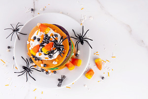 Colorful Halloween Pancakes with candy, pumpkin spider decoratio, a Food & Drink Photo by Rimma