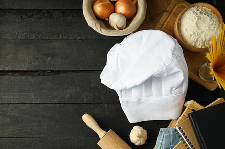 Composition with chef hat for concept of cooking, space for text, a Food & Drink Photo by AtlasStudio PRO