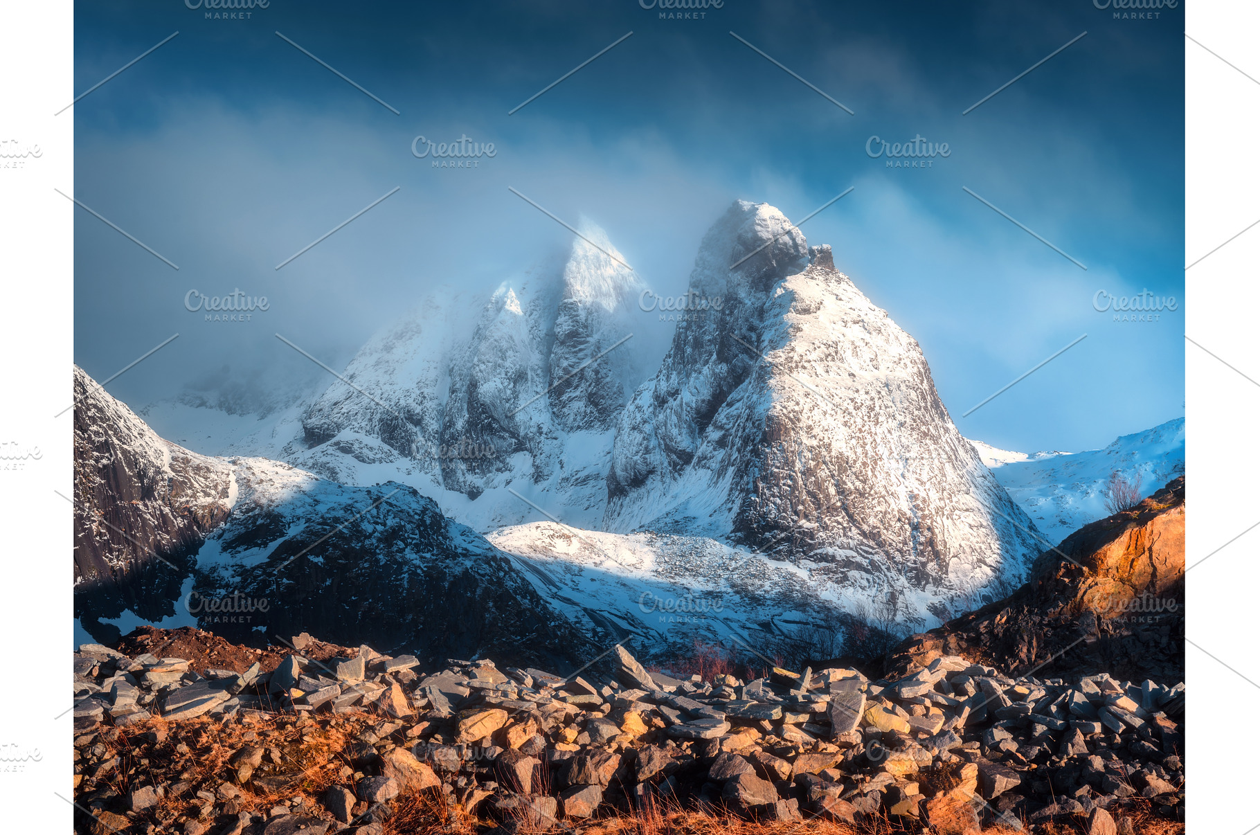 Snow-capped mountain peaks in low, a Nature Photo by den-belitsky