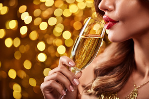 Macro of woman drinking sparkling wine with background golden bo, a Holiday Photo by Davizro's Market