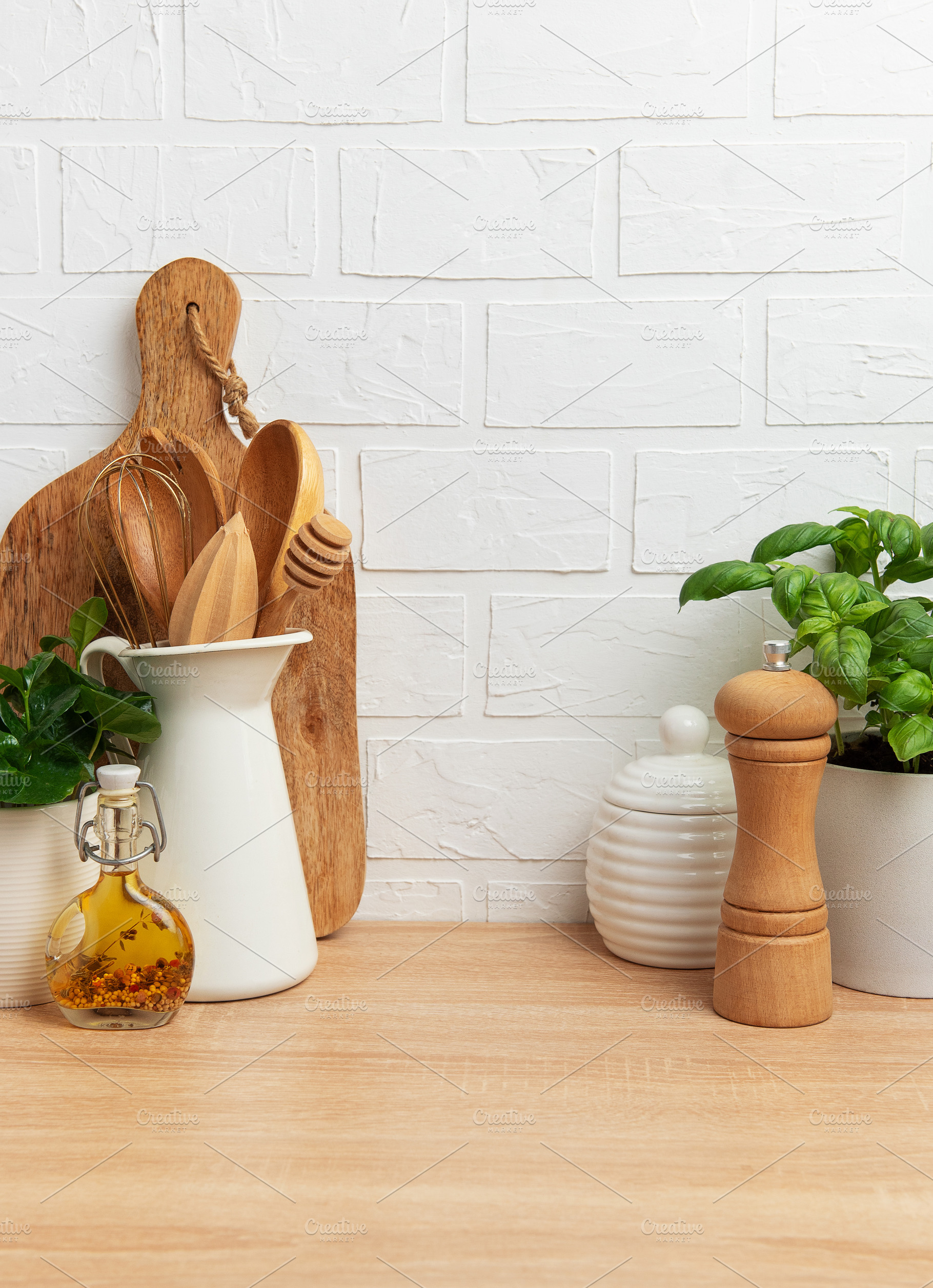 Kitchen utensils, basil plant and spices creating cozy atmospher, a Food & Drink Photo by Olena Rudo