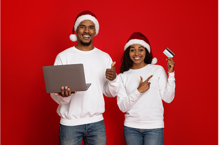 Happy couple in Santa hats with, a Person Photo by Prostock-Studio