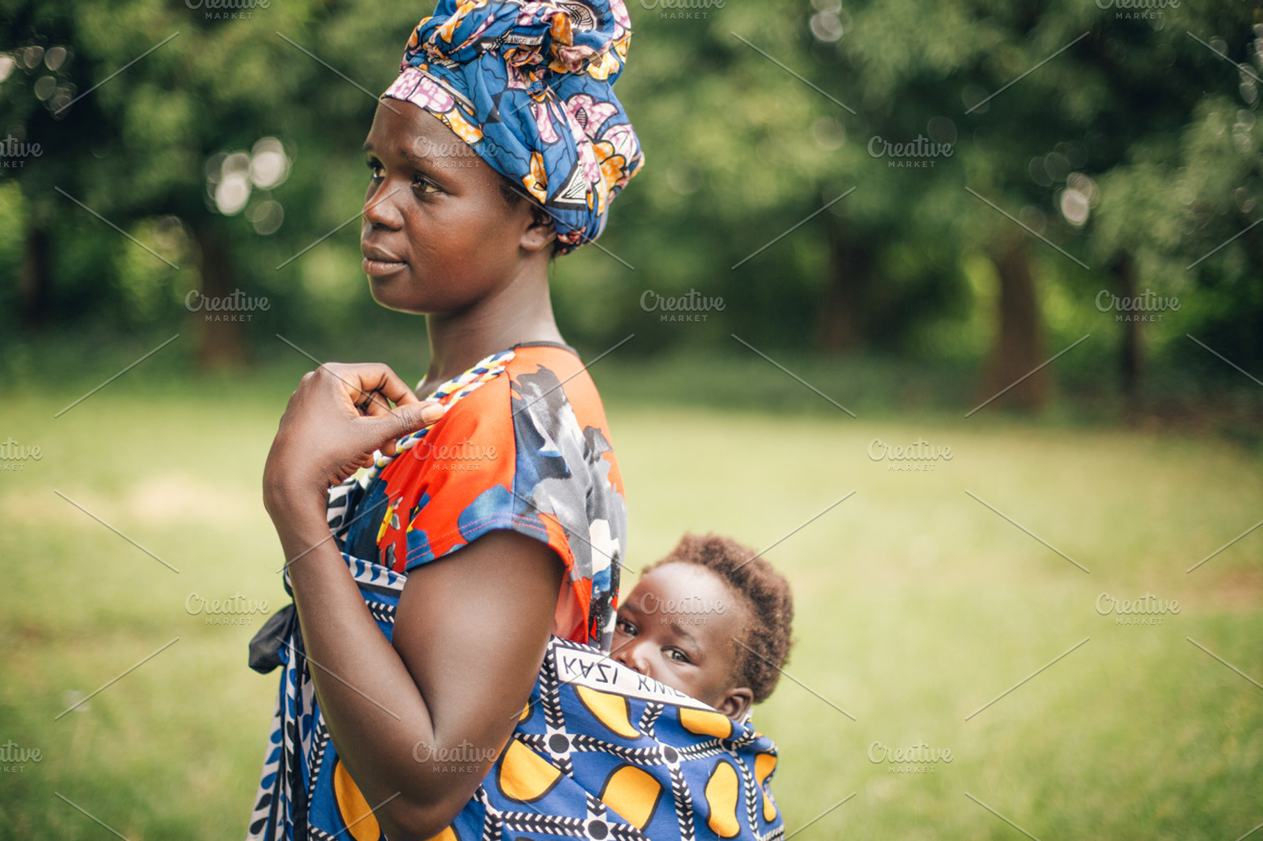 African Mother Carries Child on Back, a Person Photo by Legends Hill