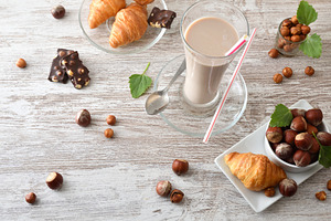 Refreshing hazelnut drink and croissants a snack, a Food & Drink Photo by Davizro's Market