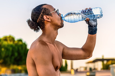 Man drinking water after workout, a Person Photo by Perpis