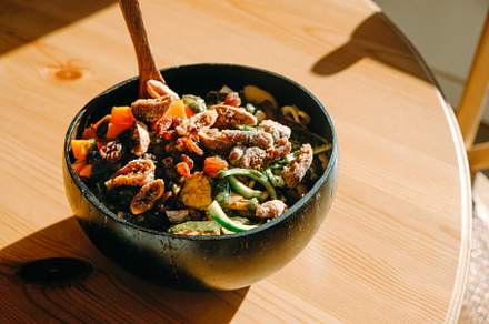 coconut bowl with salad on a table, a Photo by Nito