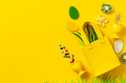 Felt Easter decorations and sweets on yellow background, a Holiday Photo by Natalia Klenova's Shop