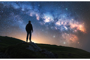 Glowing Milky Way and man on, a Nature Photo by den-belitsky