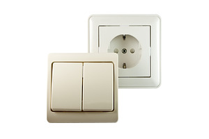 Switch and socket containing switch, socket, and wall, a Technology Photo by Leonid Andronov