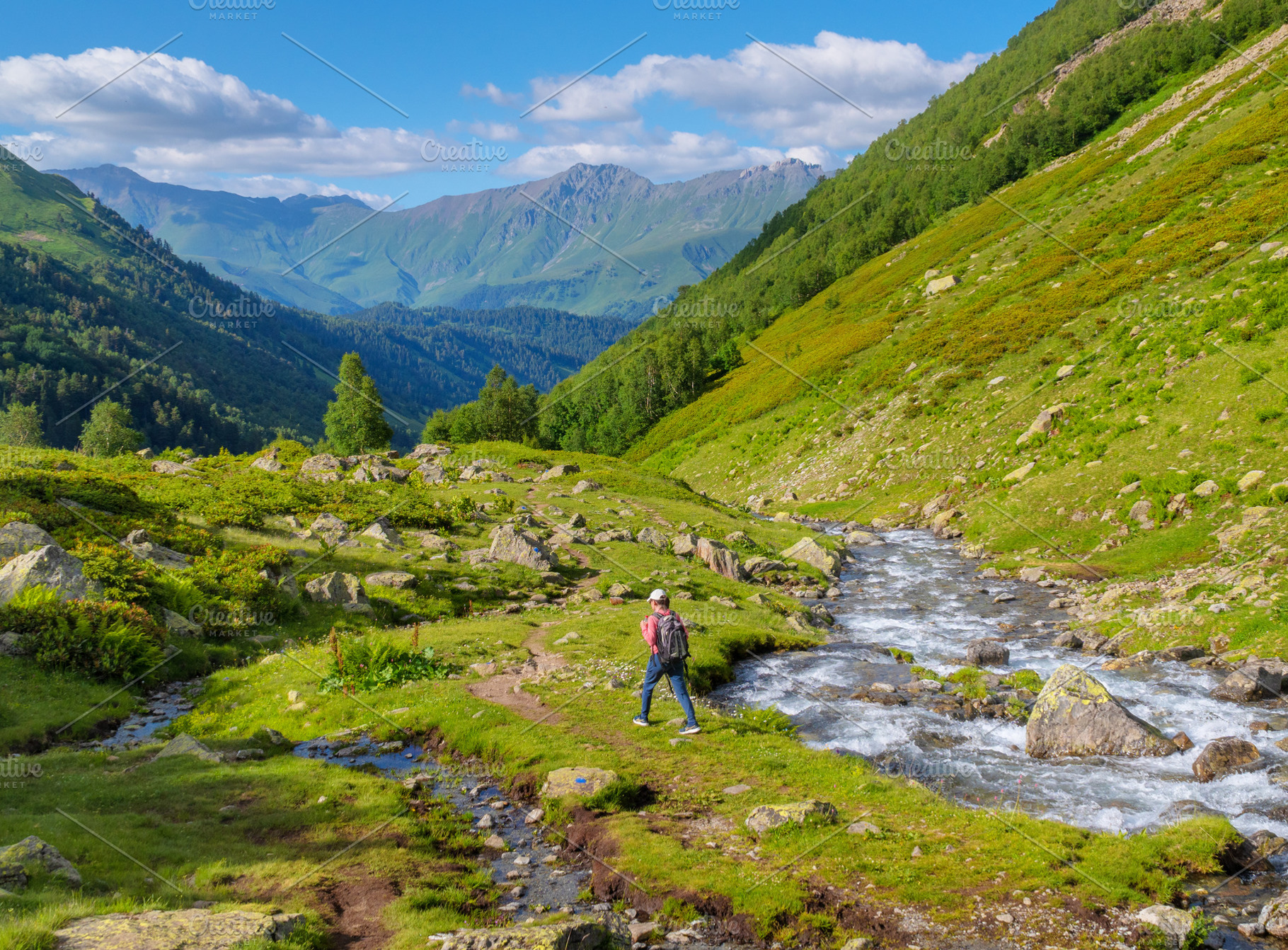 Cute young woman in mountain valley., a Photo by djgis