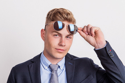 Portrait of a confident young man containing studio, shot, and portrait, a Person Photo by HalfPoint