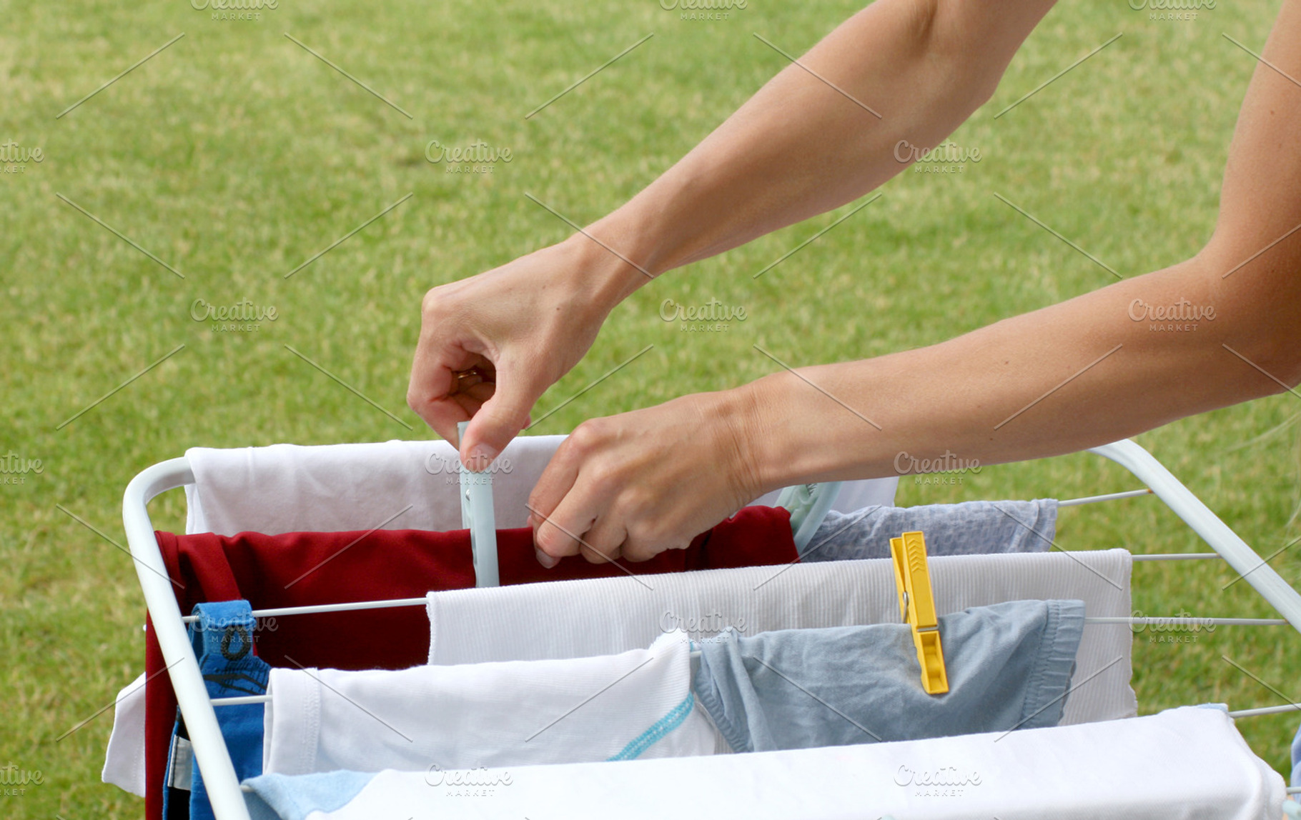 Woman hands and laundry, a Person Photo by BOOCYS