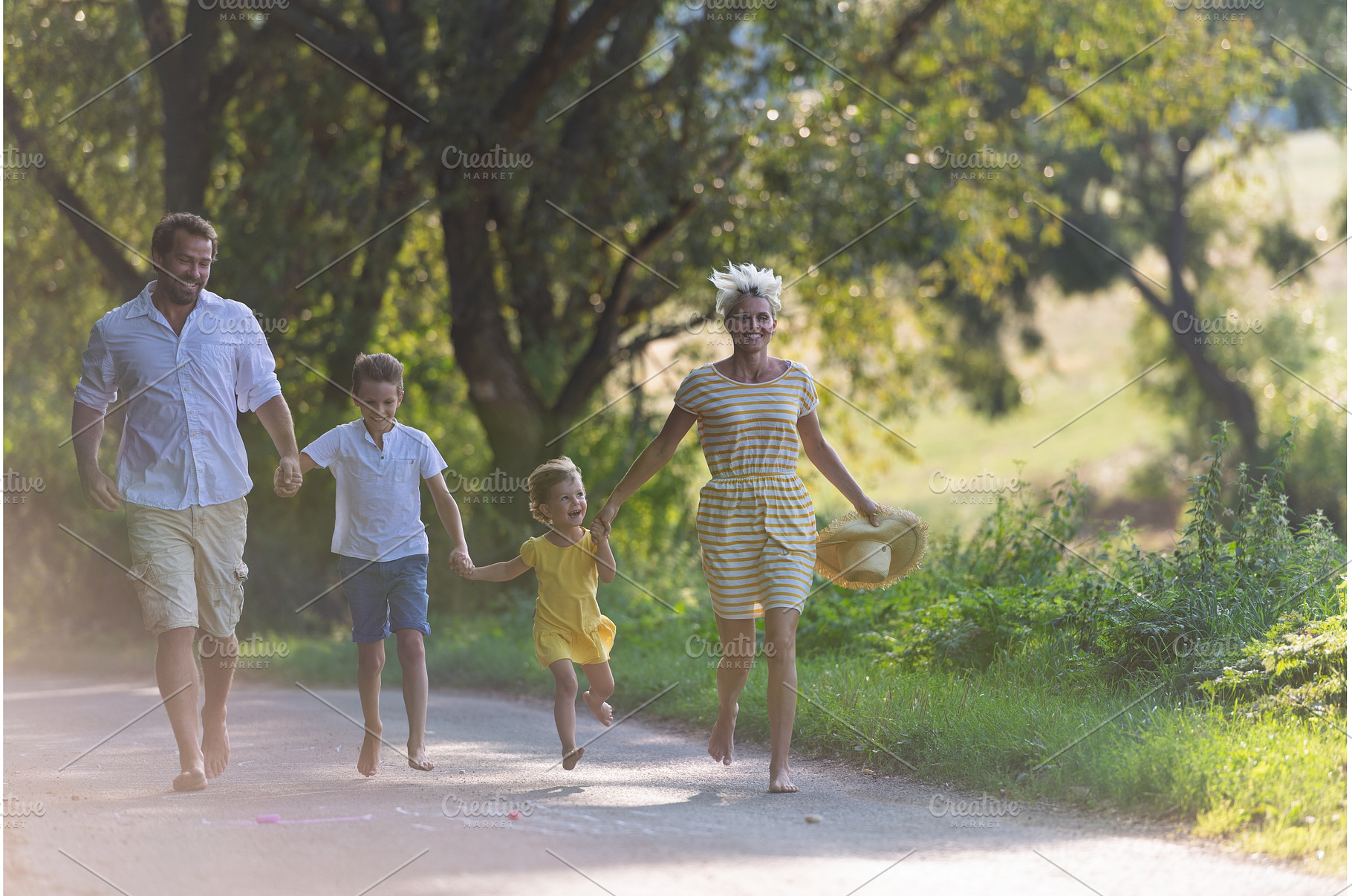 A family with small children walking, a Person Photo by HalfPoint