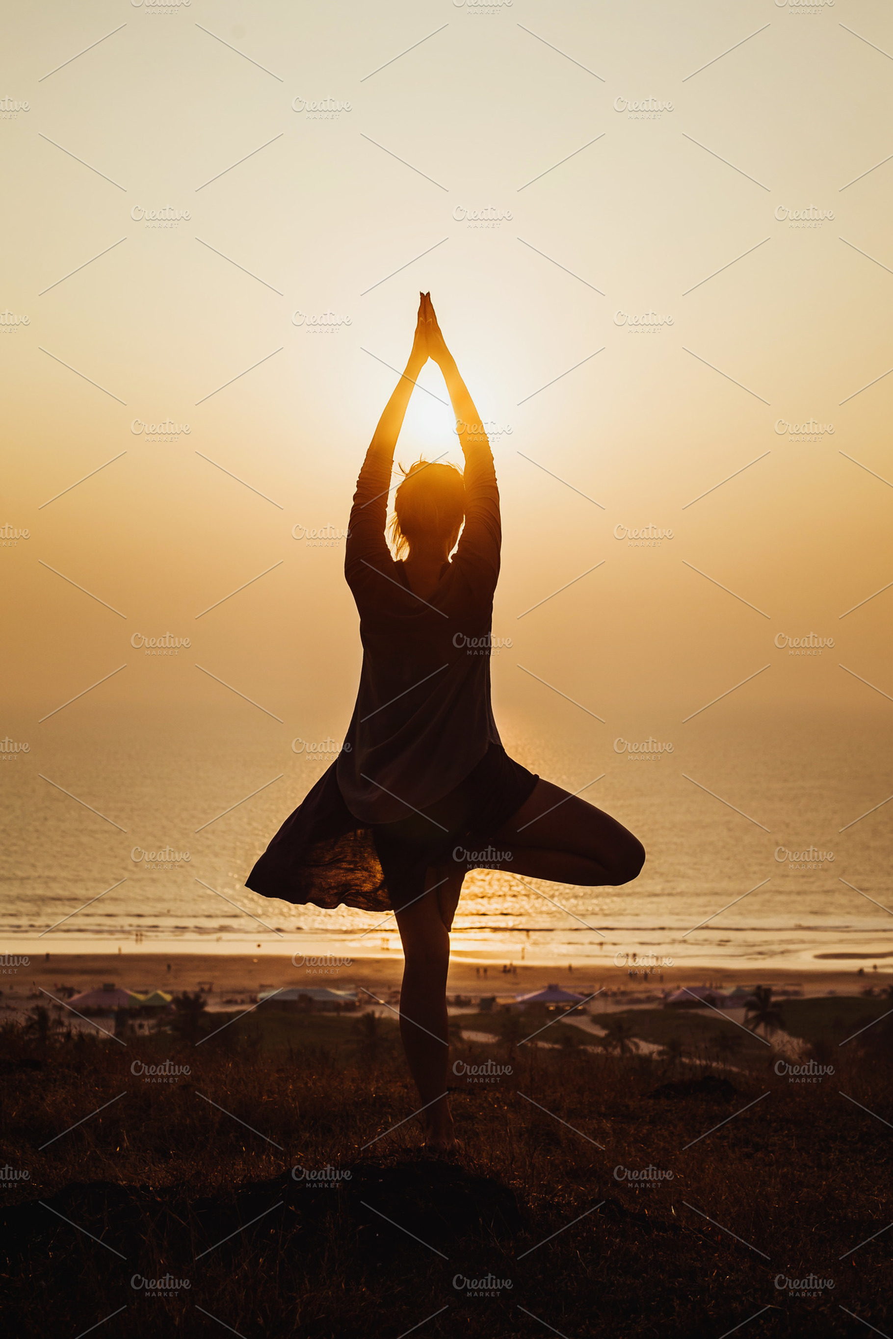 Yoga featuring sunset, sea, and body, a Health & Medical Photo by kosmopolya
