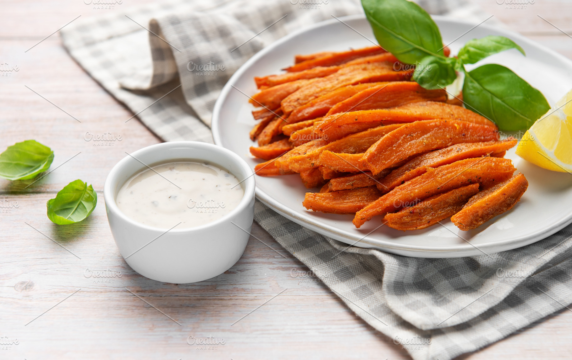 Sweet potato fries with dip, basil, and lemon, a Food & Drink Photo by Olena Rudo