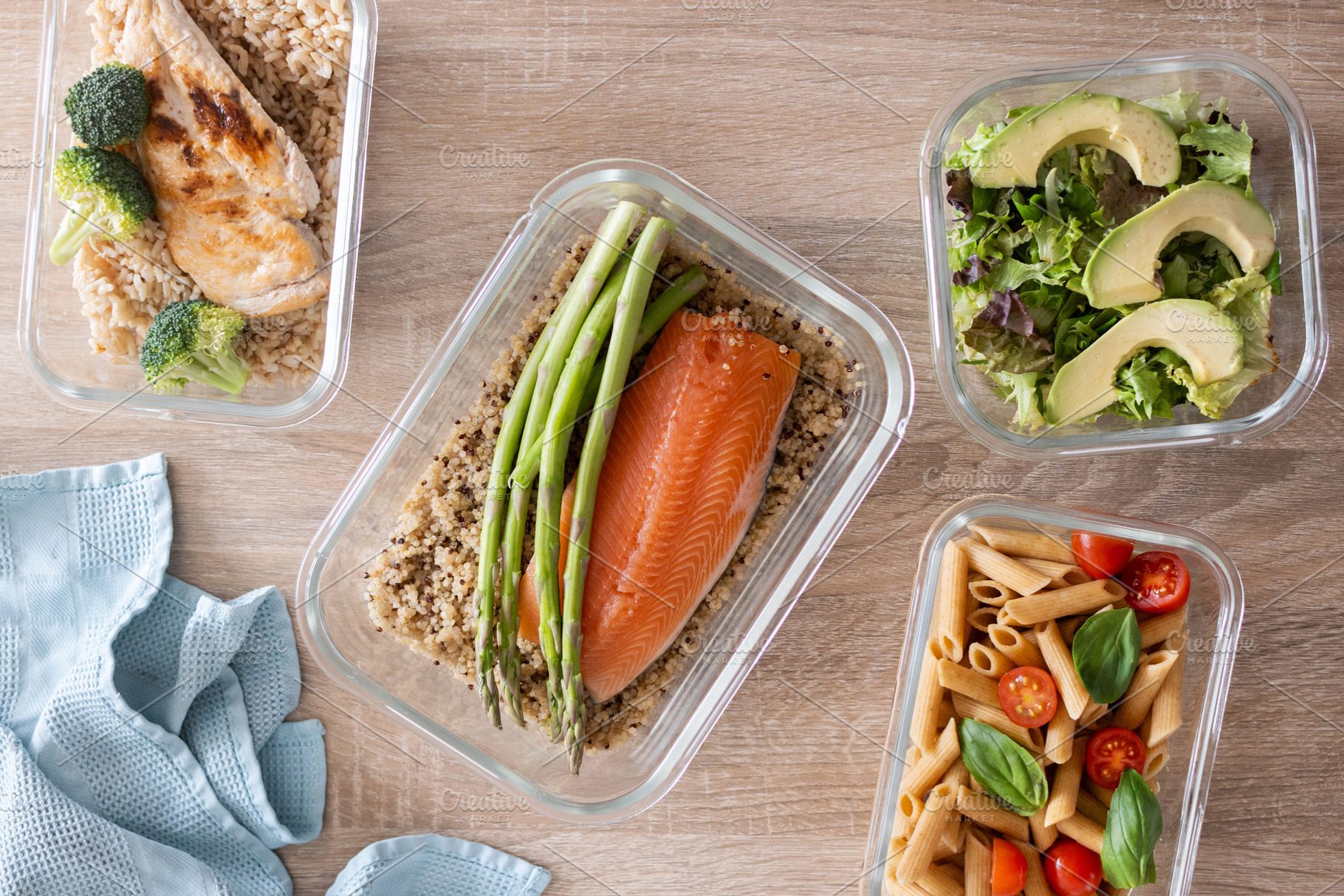 Healthy meal prep containers with salmon, chicken, pasta and fresh vegetables, a Food & Drink Photo by etorres69