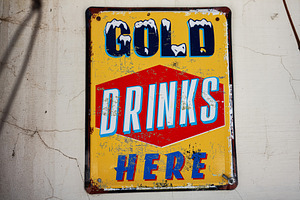 Vintage advertising sign promoting cold drinks currently, a Photo by AS photostudio