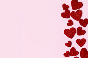 Stylish valentine hearts flat lay. Red glitter hearts on pink pa, a Holiday Photo by Sonjachni